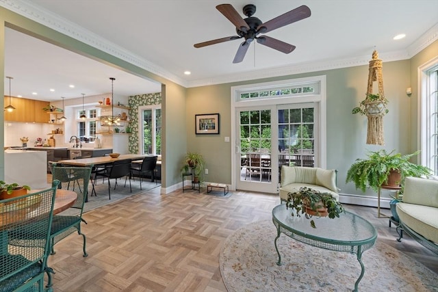 22 Flintlock Rd, Lexington, MA 02420 - living room featuring plenty of natural light, a baseboard radiator, recessed lighting, a ceiling fan, and crown molding
