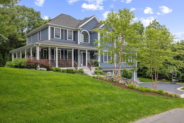 22 Flintlock Rd, Lexington, MA 02420 - view of front of house featuring covered porch, a front yard, and driveway