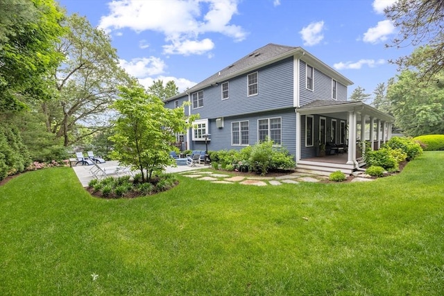 22 Flintlock Rd, Lexington, MA 02420 - rear view of house featuring a patio, a yard, and a deck