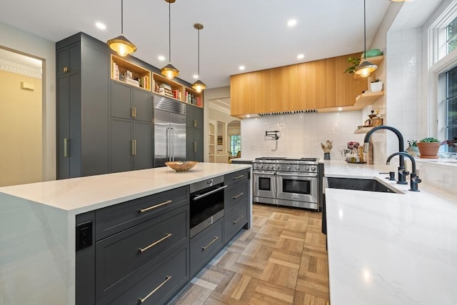 22 Flintlock Rd, Lexington, MA 02420 - kitchen featuring high end appliances, open shelves, decorative light fixtures, a kitchen island, and backsplash