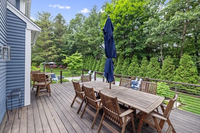 22 Flintlock Rd, Lexington, MA 02420 - wooden deck with outdoor dining space and view of scattered trees