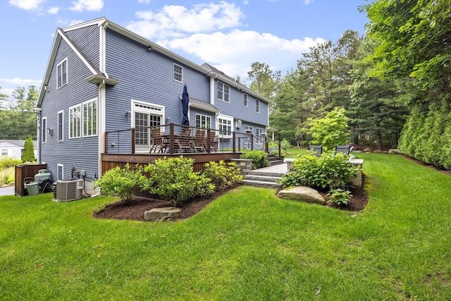 22 Flintlock Rd, Lexington, MA 02420 - rear view of property with a wooden deck and a yard
