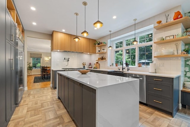 22 Flintlock Rd, Lexington, MA 02420 - kitchen with open shelves, stainless steel appliances, decorative backsplash, a kitchen island, and recessed lighting