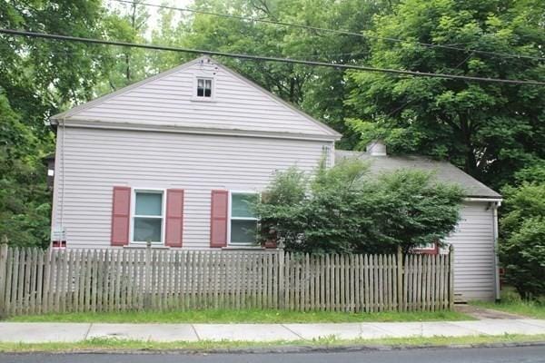 46 Colrain St, Greenfield, MA 01301 - view of home's exterior with a fenced front yard