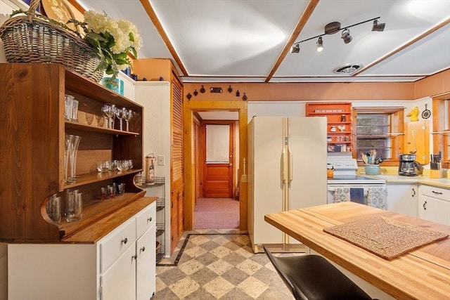 kitchen featuring white appliances, open shelves, white cabinetry, light floors, and butcher block countertops