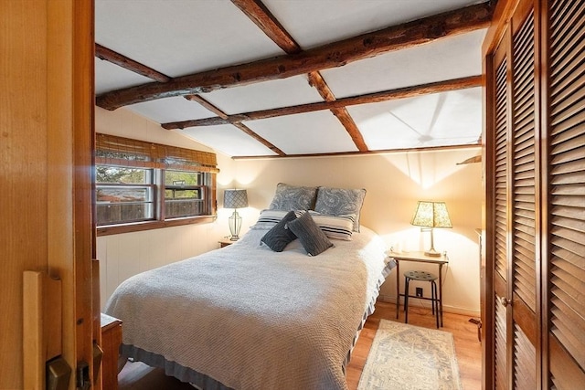 bedroom featuring wood finished floors and a closet