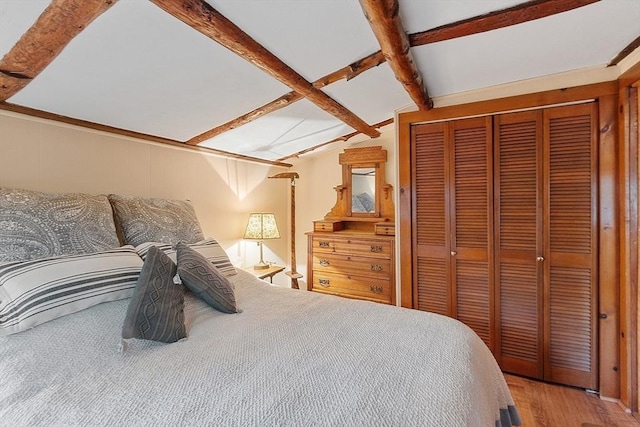 bedroom featuring a closet and wood finished floors