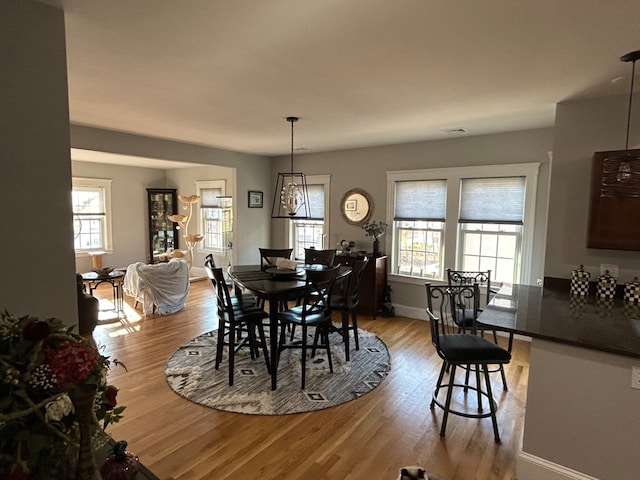 dining space featuring light hardwood / wood-style floors and a wealth of natural light