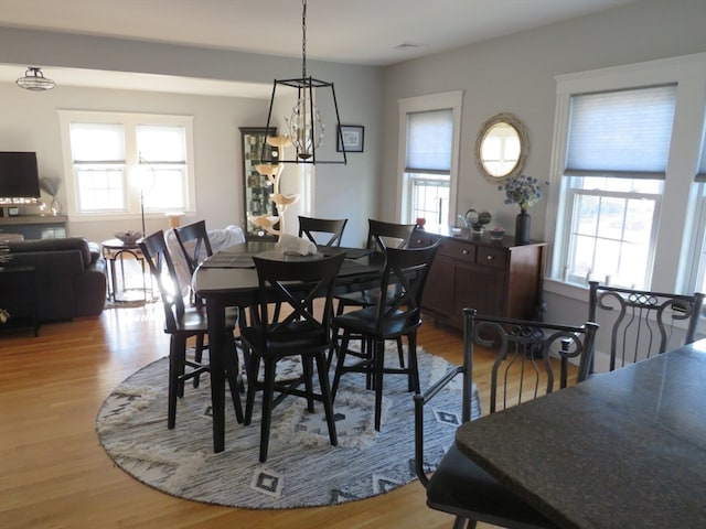 dining space with light wood-type flooring