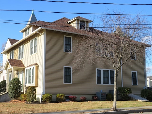 view of property exterior with central AC