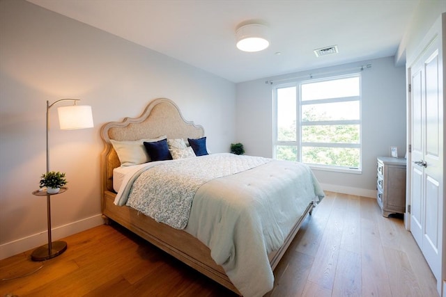 bedroom with light wood-type flooring