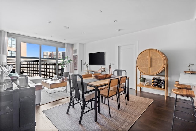 dining area with dark hardwood / wood-style floors