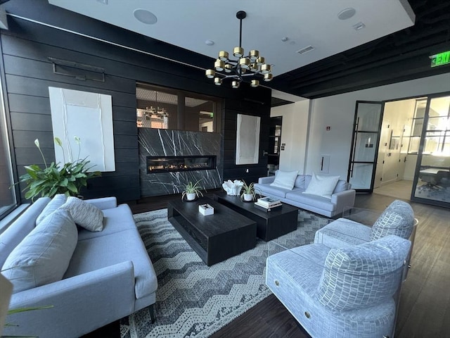 99 Sumner St Unit 307, Boston, MA 02128 - living room featuring a chandelier, wood finished floors, and a high end fireplace