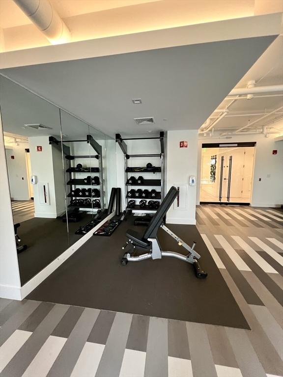 99 Sumner St Unit 307, Boston, MA 02128 - exercise room featuring baseboards