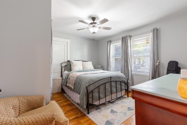 36-38 Priesing St, Boston, MA 02130 - bedroom featuring light wood-type flooring, a ceiling fan, and radiator