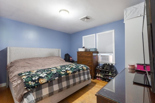 36-38 Priesing St, Boston, MA 02130 - bedroom with wood finished floors and cooling unit