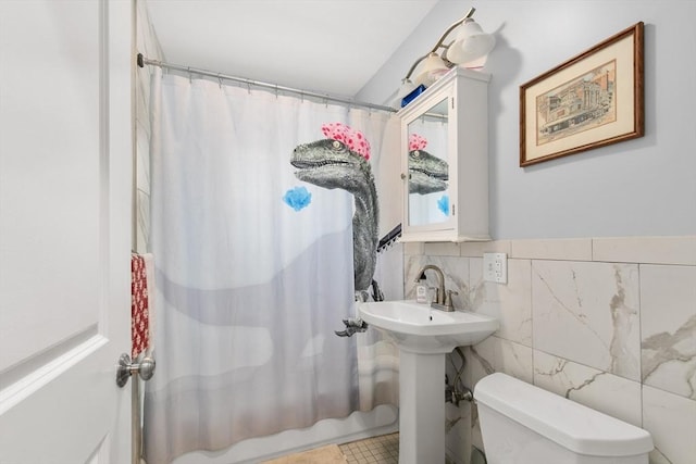 36-38 Priesing St, Boston, MA 02130 - full bathroom featuring toilet, tile walls, shower / bath combination with curtain, and a sink