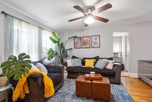 36-38 Priesing St, Boston, MA 02130 - living room with wood finished floors, ceiling fan, cooling unit, and baseboards