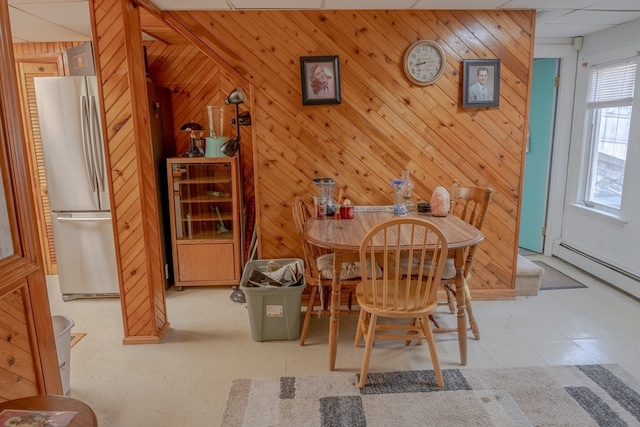 dining area with wood walls