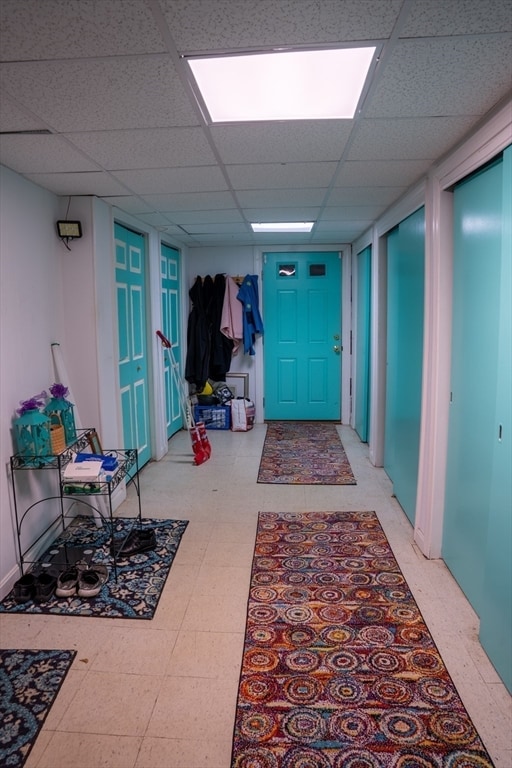 hallway featuring a paneled ceiling