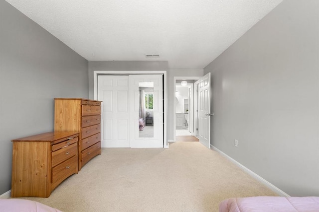 2012 Franklin Crossing Rd Unit 2012, Franklin, MA 02038 - bedroom with light carpet and a closet