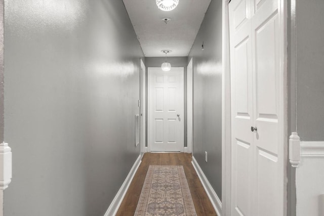 2012 Franklin Crossing Rd Unit 2012, Franklin, MA 02038 - corridor with dark wood finished floors and baseboards