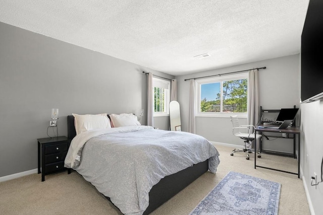 2012 Franklin Crossing Rd Unit 2012, Franklin, MA 02038 - bedroom with light colored carpet, a textured ceiling, and a desk