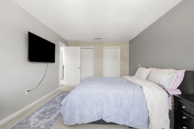 2012 Franklin Crossing Rd Unit 2012, Franklin, MA 02038 - bedroom with two closets and light colored carpet