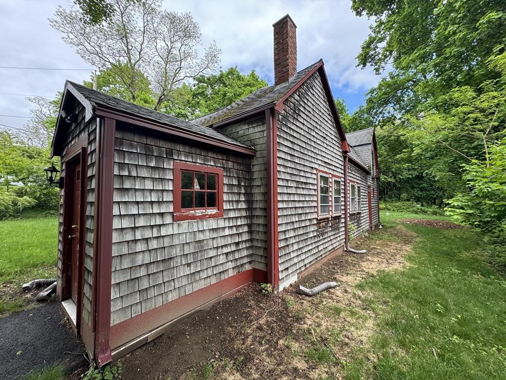 54 Plymouth St, East Bridgewater, MA 02333 - view of property exterior featuring a chimney