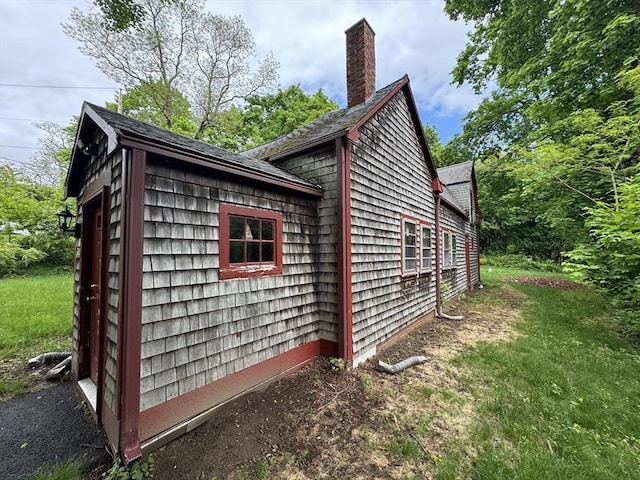 54 Plymouth St, East Bridgewater, MA 02333 - view of property exterior featuring a chimney