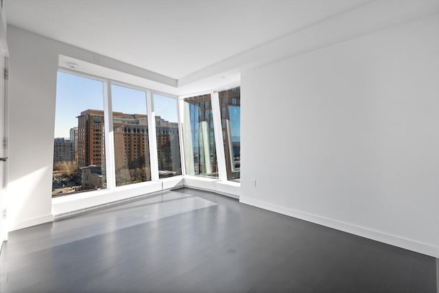 spare room featuring hardwood / wood-style flooring