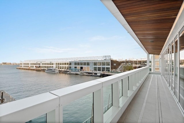 balcony featuring a water view