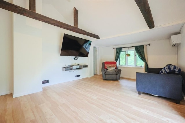 268 Wallace Hill Rd, Townsend, MA 01469 - living area with beamed ceiling, wood finished floors, a wall mounted air conditioner, and high vaulted ceiling