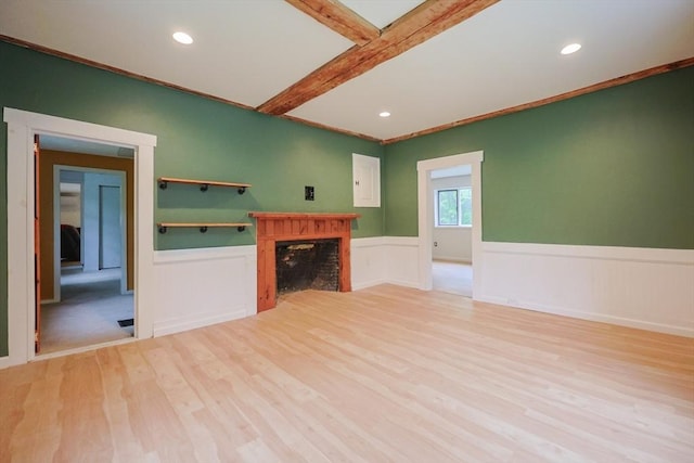 268 Wallace Hill Rd, Townsend, MA 01469 - unfurnished living room with light wood-style floors, a wainscoted wall, a fireplace, recessed lighting, and beam ceiling