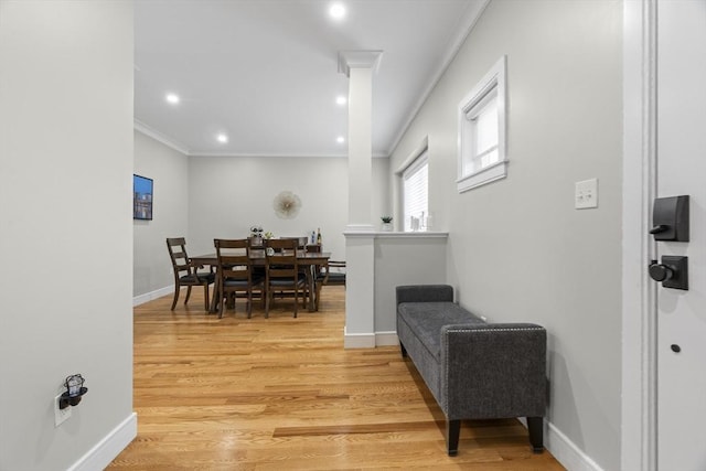 33 Peirce St Unit 1, Waltham, MA 02453 - dining area with light wood-type flooring, crown molding, and baseboards