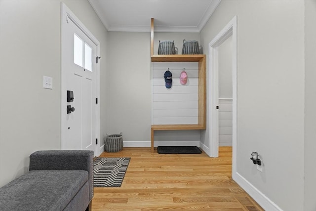 33 Peirce St Unit 1, Waltham, MA 02453 - mudroom with baseboards, crown molding, and wood finished floors