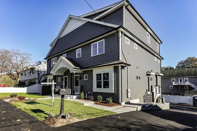 33 Peirce St Unit 1, Waltham, MA 02453 - view of front of property with a front lawn and fence