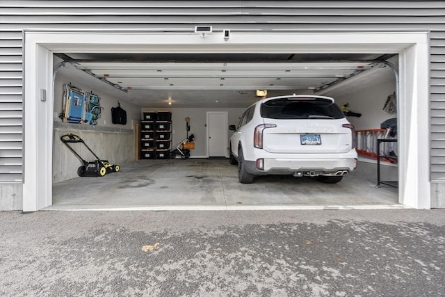 33 Peirce St Unit 1, Waltham, MA 02453 - garage with a garage door opener