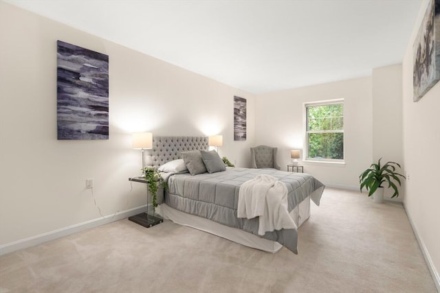 bedroom featuring carpet floors and baseboards