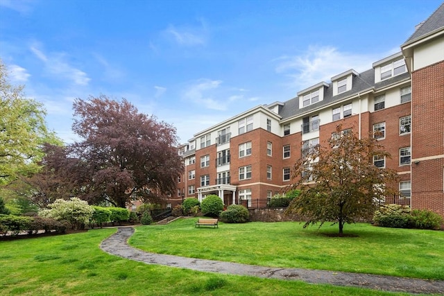 view of property's community with a lawn