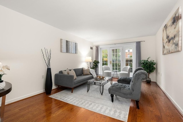 living area featuring wood finished floors and baseboards
