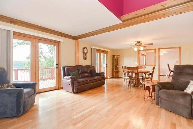 living room with ceiling fan, light hardwood / wood-style floors, and a wealth of natural light