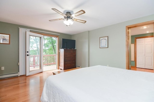 bedroom with access to exterior, ceiling fan, light hardwood / wood-style floors, and a baseboard radiator