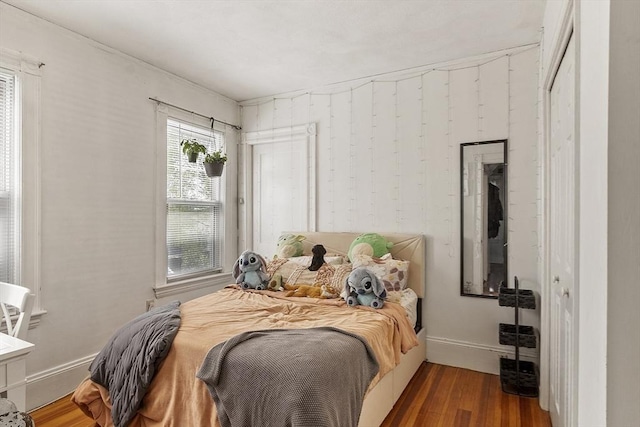 136-138 N St, Somerville, MA 02144 - bedroom with baseboards and wood finished floors