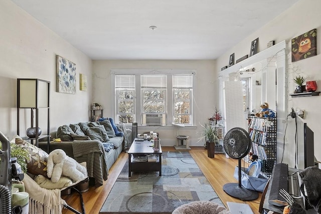 136-138 N St, Somerville, MA 02144 - living area featuring baseboards, cooling unit, and wood finished floors