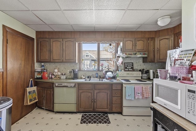 136-138 N St, Somerville, MA 02144 - kitchen with a sink, decorative backsplash, white appliances, and a paneled ceiling