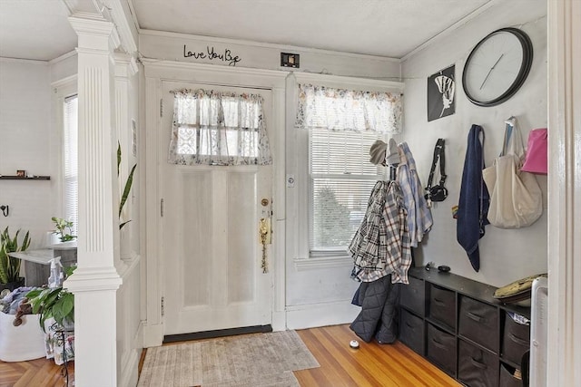 136-138 N St, Somerville, MA 02144 - foyer featuring ornate columns, crown molding, and a healthy amount of sunlight