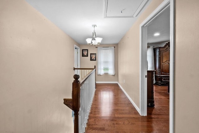230 Plain, Taunton, MA 02780 - corridor featuring dark wood-style flooring, attic access, an upstairs landing, baseboards, and a chandelier