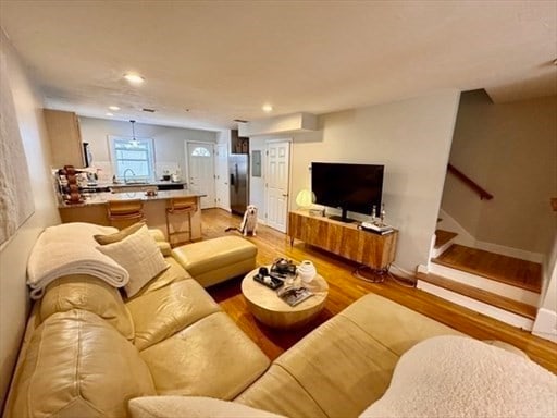 living room with light hardwood / wood-style floors