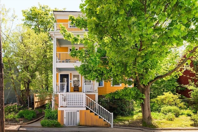 67 Jamaica Unit 3, Boston, MA 02130 - view of front facade with a balcony, a porch, and stairs